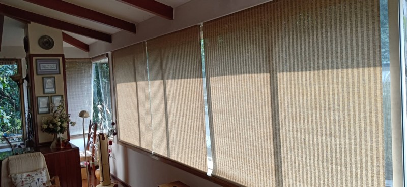 Row of jute roller blinds in a sitting room