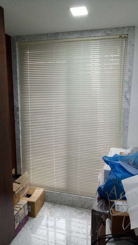 Vanishing blinds on a tall office window