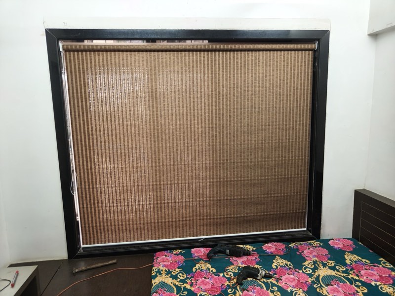 Natural bamboo blind in a bedroom