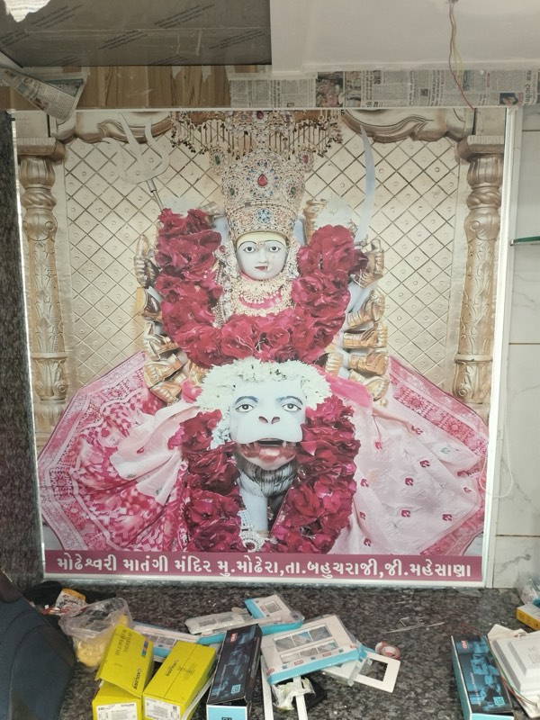 Printed blind of a garlanded goddess for a home mandir