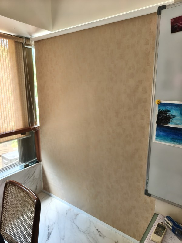 Full-height sand roller blind in an office